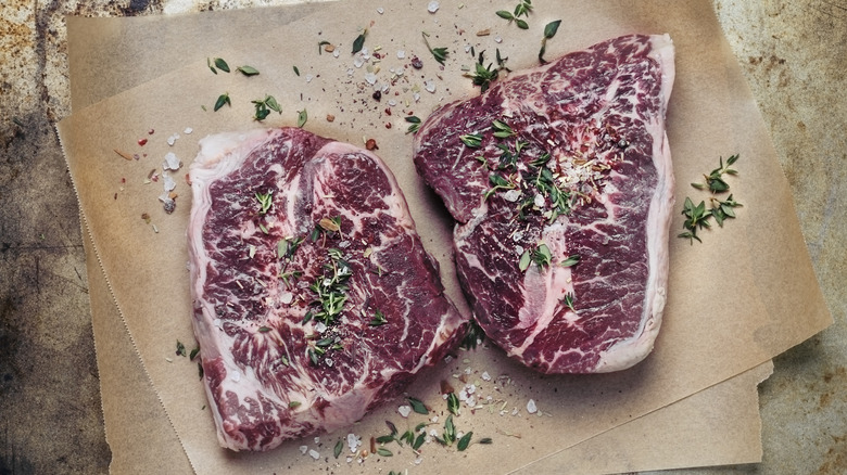 Two large pieces of raw steak