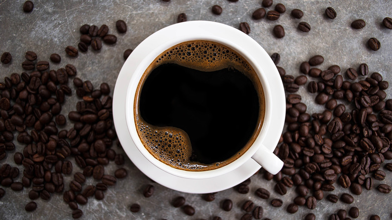 Coffee cup and beans