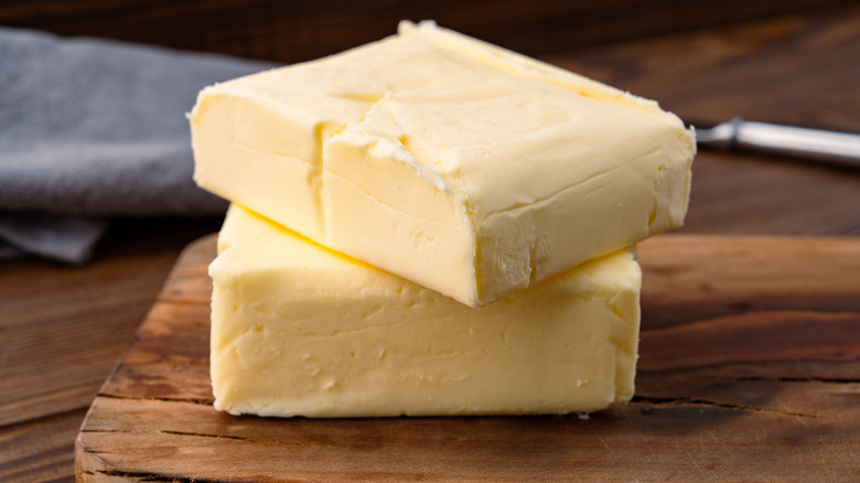 Butter that adds flavor to meals and is for breakfast on a wooden background