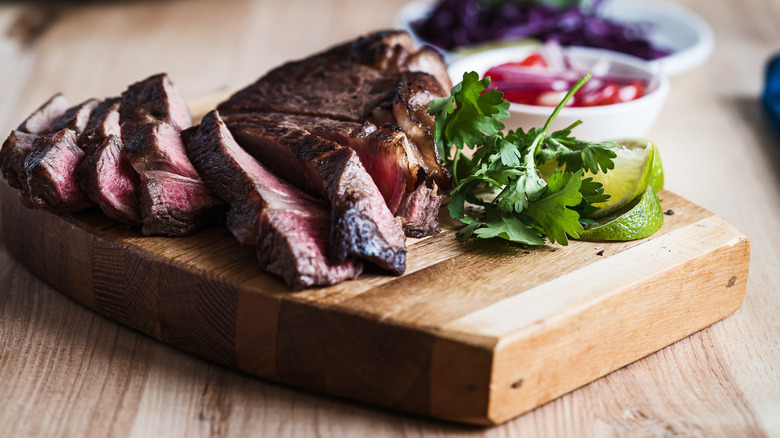 Sliced sirloin on cutting board