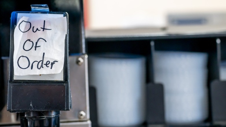 Note that reads "out of order" taped to a soda fountain dispenser