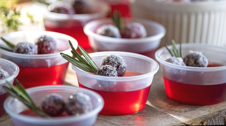 Jell-O shots with sugared cranberries and rosemary