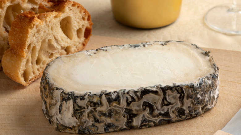 Close-up of slice of aged monte enebro Spanish goat cheese