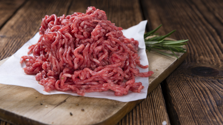 ground meat on cutting board