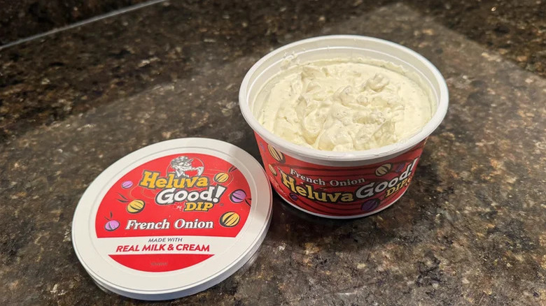 a tub of the fresh onion dip by Heluva Good! sitting on a counter