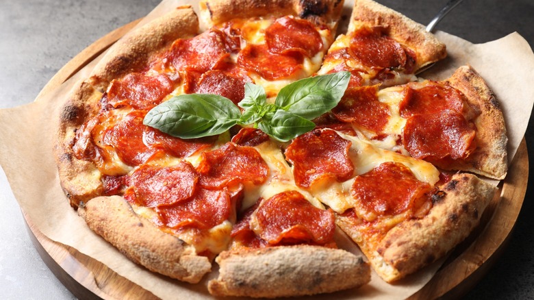 Pepperoni pizza on a plate.