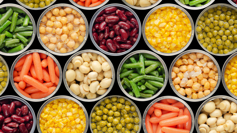 Aerial view of opened canned vegetables.