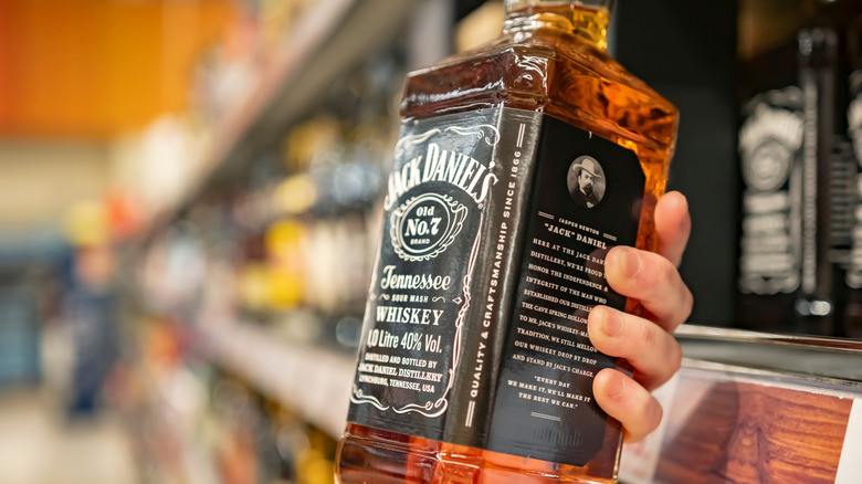 Person holding bottle of Jack Daniel's Old No. 7
