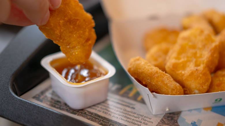 Dipping McDonald's nugget in sauce