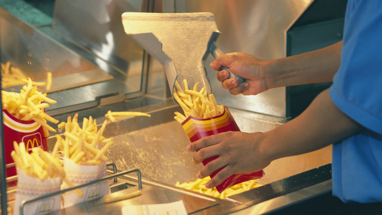 Worker packaging McDonald's fries