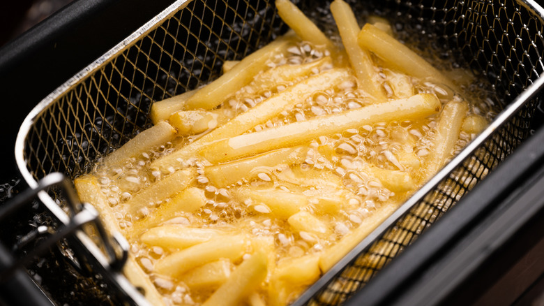 French fries cooking in a deep fryer