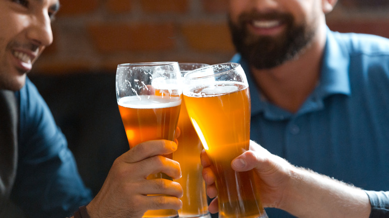 men toasting with beer