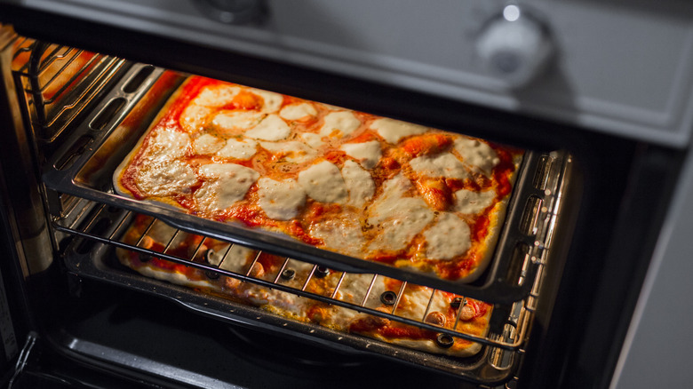 Pizza in an oven broiler