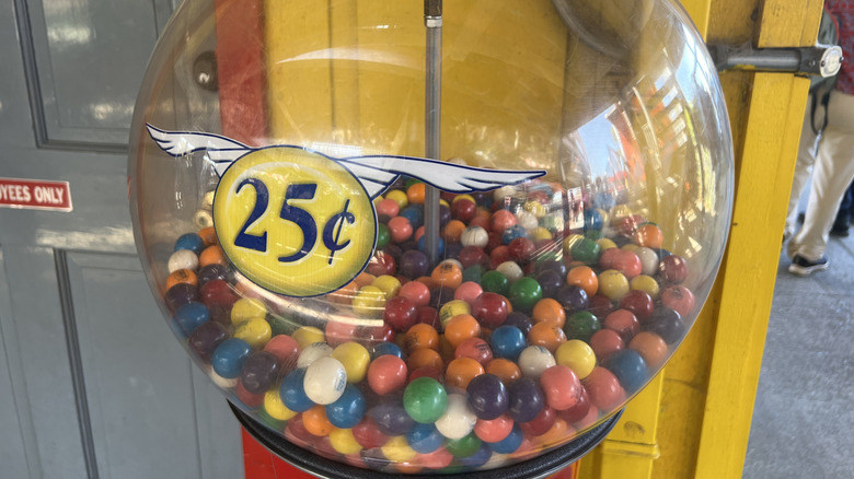 Old-school gumball machine with plenty of 25-cent gumballs inside.