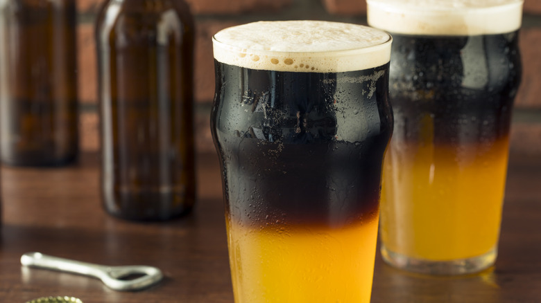 Black and tan drinks in pint glasses
