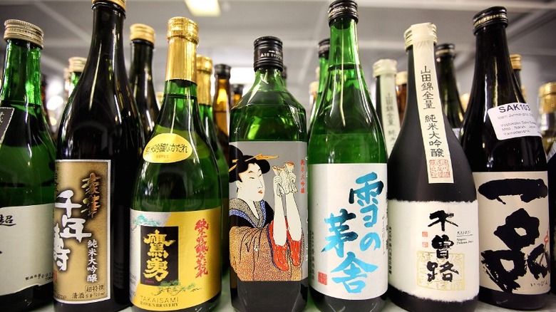Various types of sake bottles are displayed.