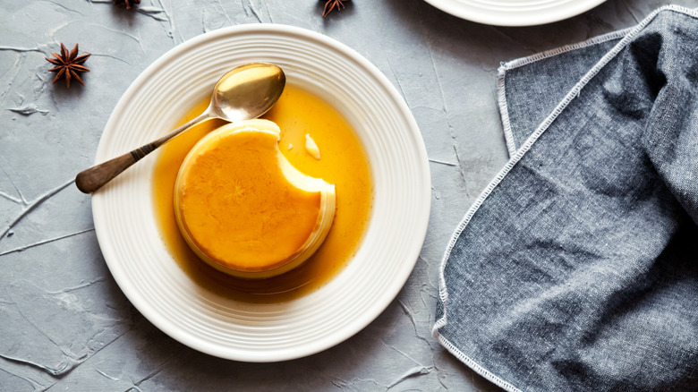 individual sized flan on a white ceramic plate