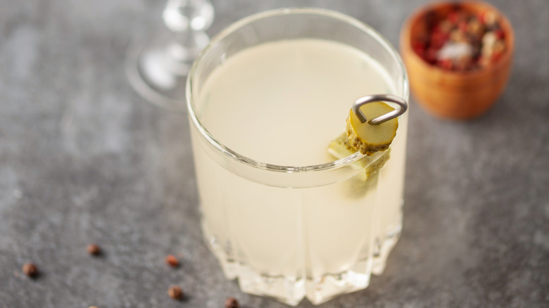 Cocktail with a pickle garnish