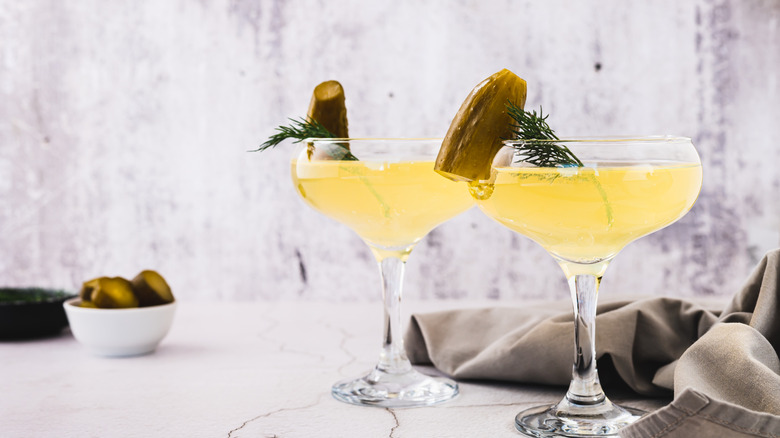 Martini glasses with pickle cocktails