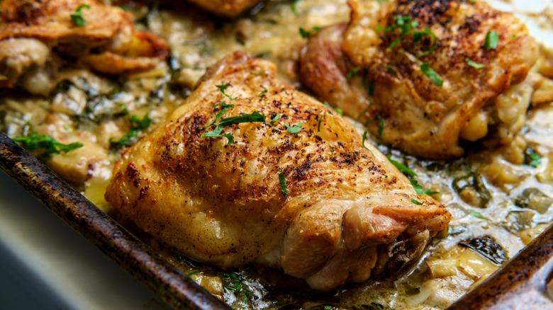 Crispy baked chicken thighs in a creamy sauce.