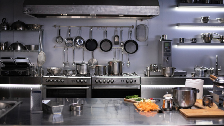 Stainless steel kitchen work surfaces and utensils