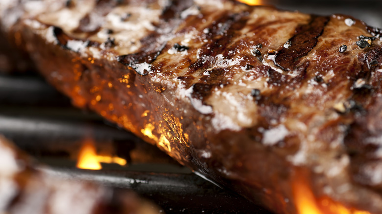 Steak cooking on grill