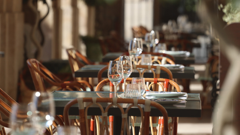 Lovely glassware tops tables in an elegantly understated restaurant