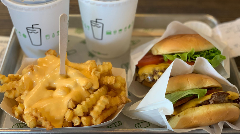 Shake Shack burgers, cheese fries, and fountain drinks