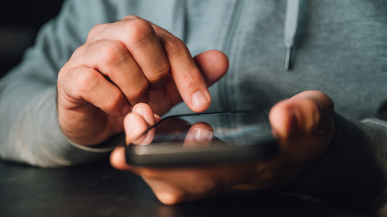 Person scrolling on phone