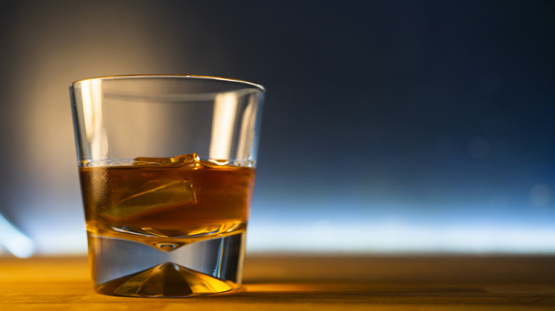 A hi-def picture of a glass of bourbon