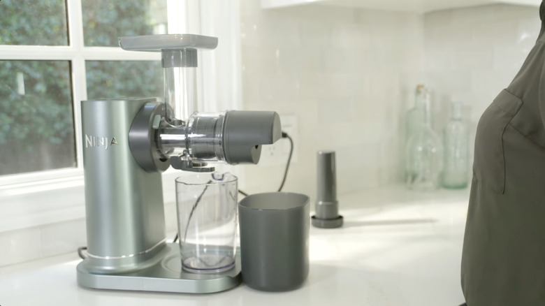 Ninja NeverClog 3-in-1 Juicer, Slicer, and Shredder on a kitchen counter