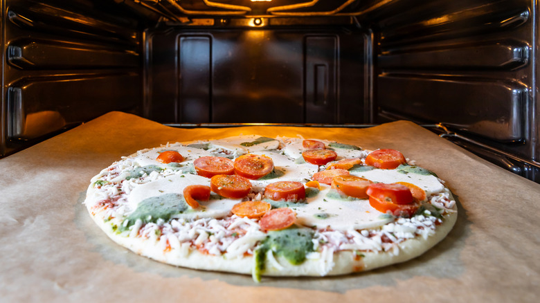 Frozen pizza baking in the oven