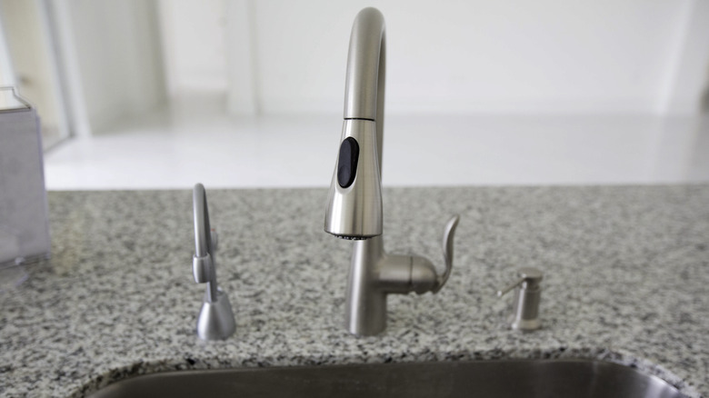 Sink with instant hot water spigot on the left side