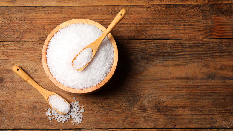 a bowl of salt on a table