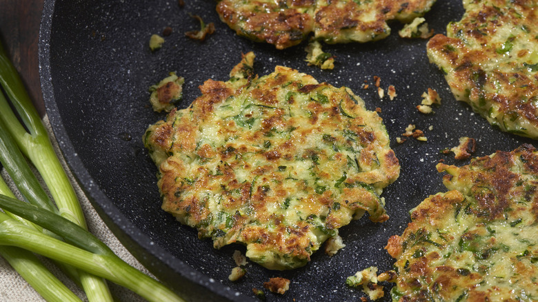 Zucchini fritters in a pan