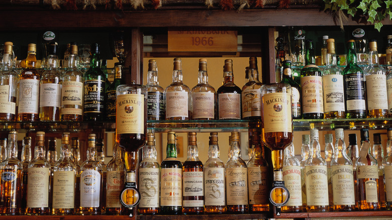 A bar displaying numerous bottles of whiskey