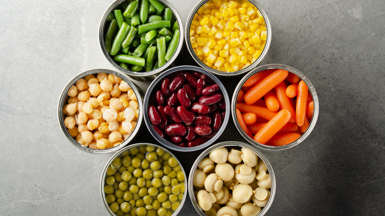 Top-view of various canned vegetables.