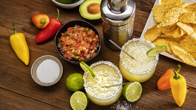 Margaritas with salsa and tortilla chips.