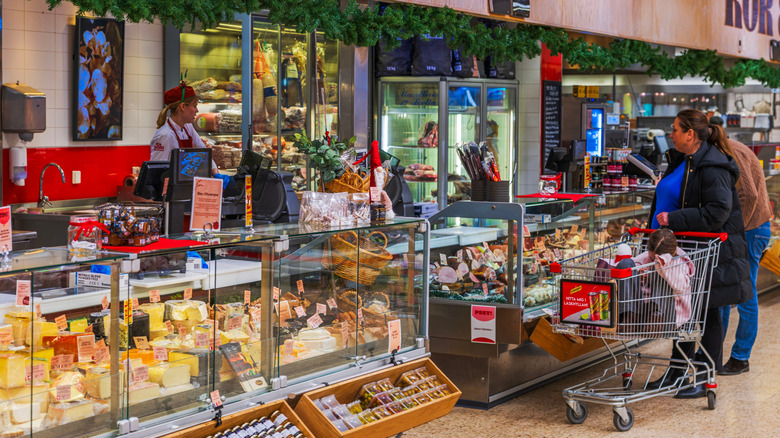 Customers shopping at a deli