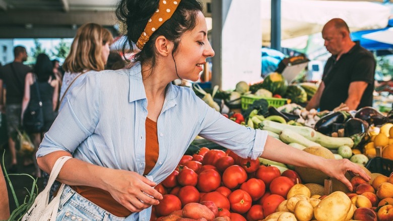 Woman shopping for produce at farmer's market