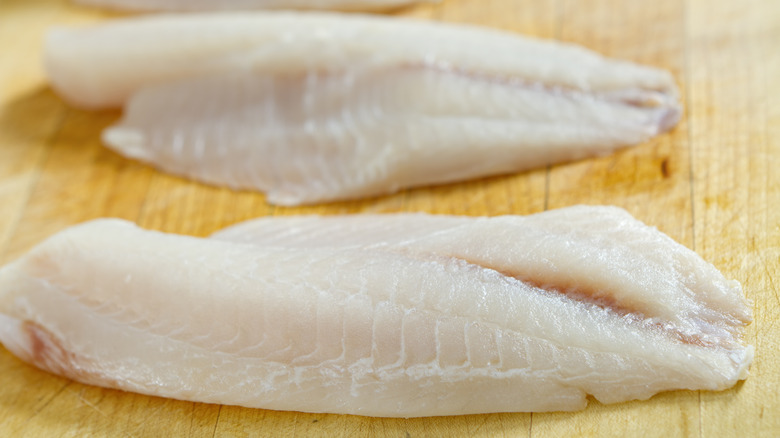 Uncooked tilapia filets