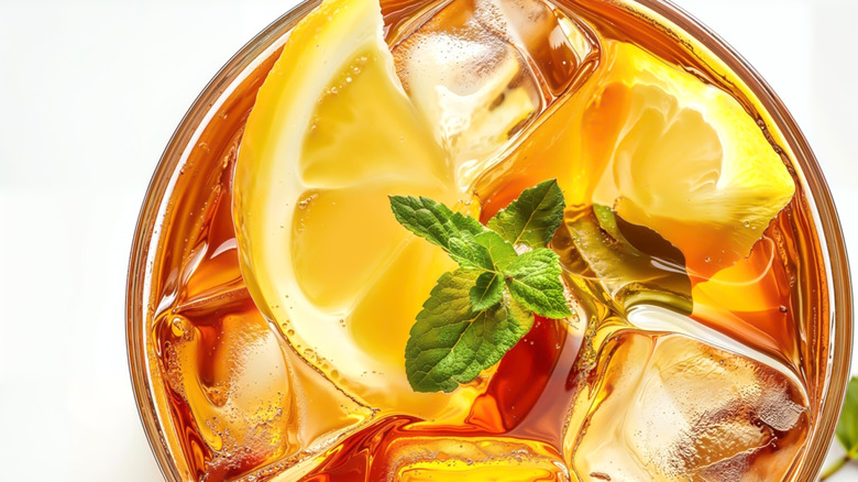 Top-down photo of iced tea with lemons and mint