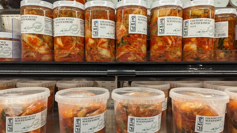 bottles of kimchi in an asian grocery