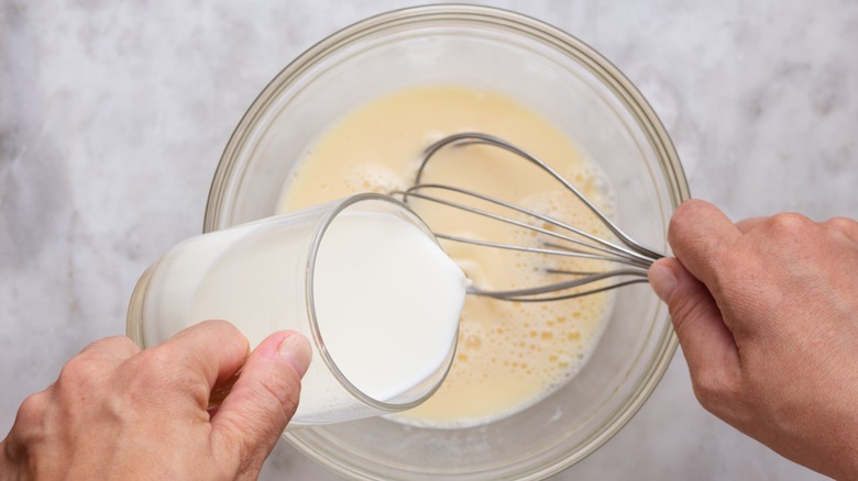 whisking ingredient into pancake batter