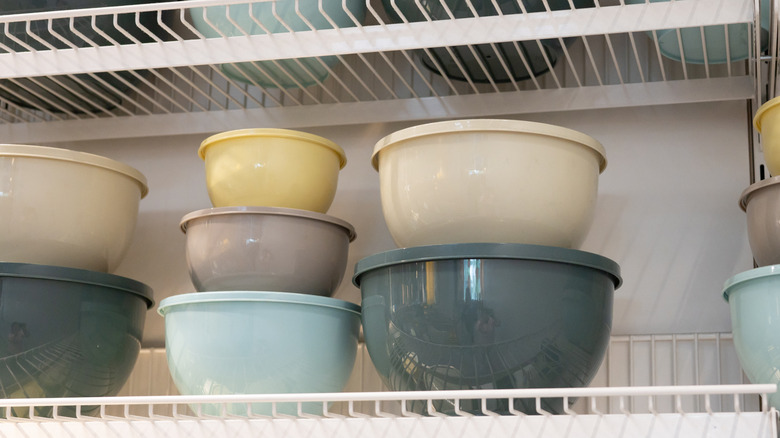wire shelving holding plastic storage bowls