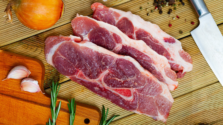 raw pork shoulder cut into slices