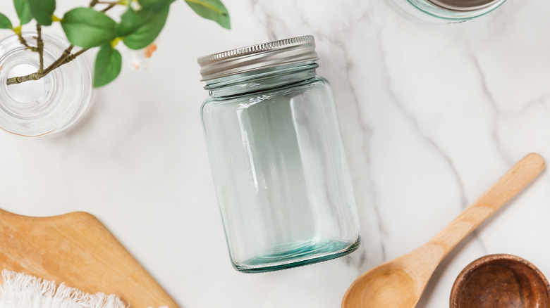 Overhead view of a mason jar lying on a kitchen countertop
