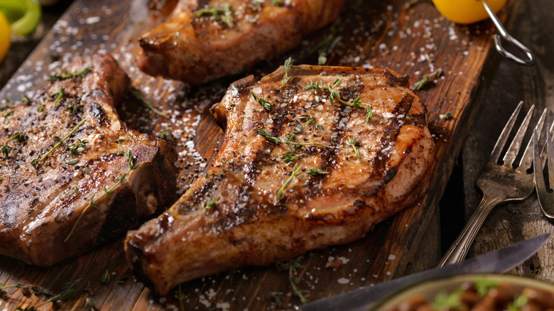 Finished pork chops with grill marks in close-up.