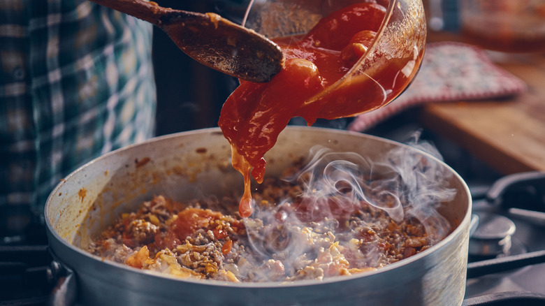 cooking tomato sauce on stovetop