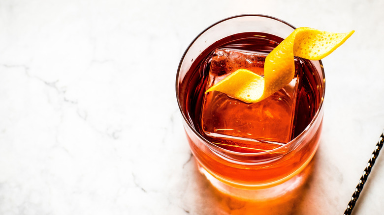 Top view of Negroni cocktail with large ice cube